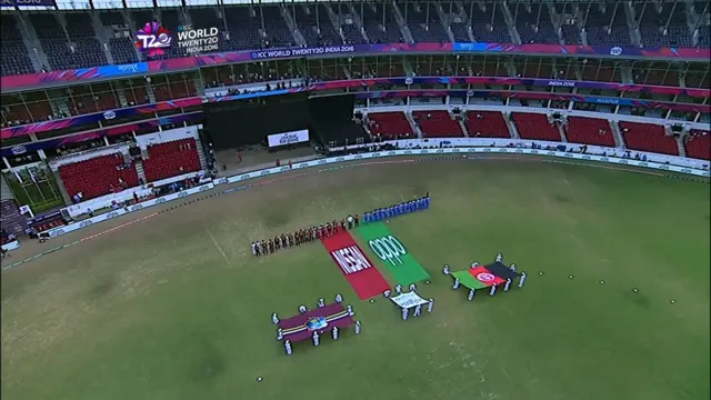 The two teams stand for the national anthem