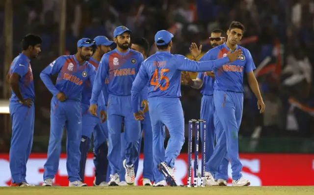 India celebrate taking a wicket