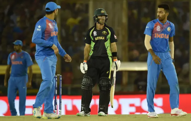 Glenn Maxwell stands with the India bowlers