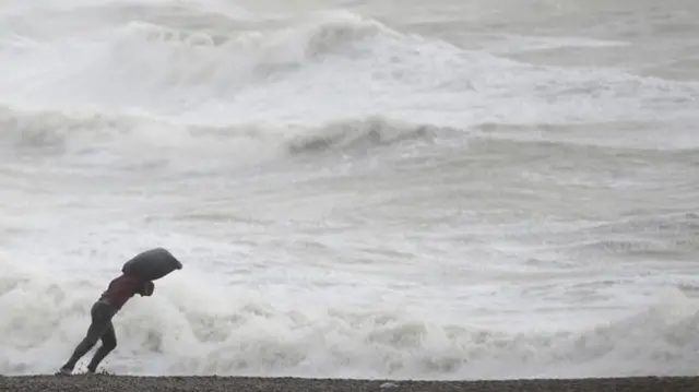 Man in strong wind