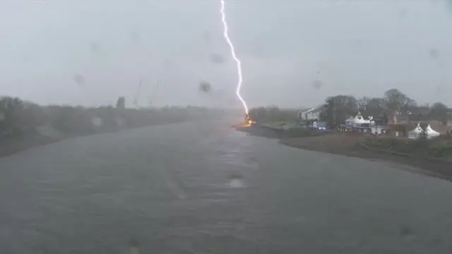 Lightening hits bank of the River Thames