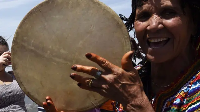 Woman playing drum