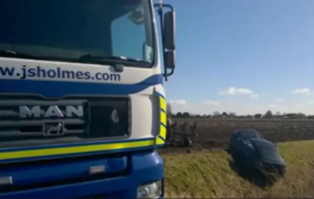 Aston Martin in ditch