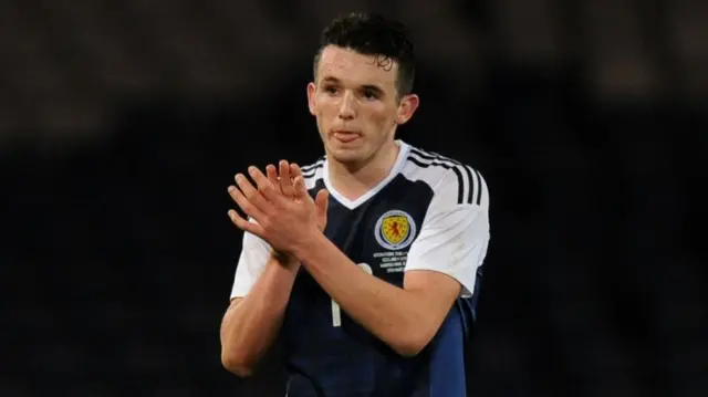 John McGinn applauds