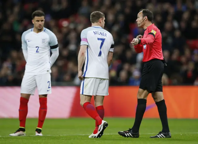 James Milner remonstrates with the referee