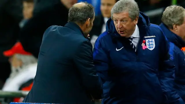 Roy Hodgson shakes hands with Netherlands coach Danny Blind