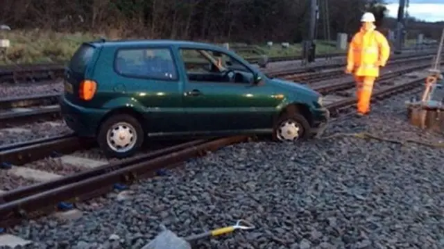 Car on rail line