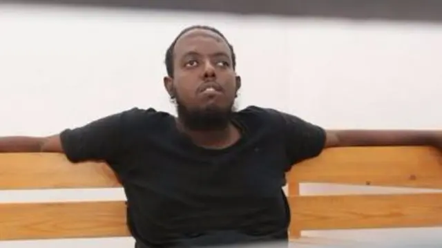 Hassan Hanafi with a big scar across his forehead