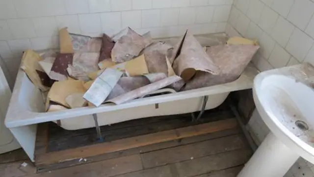 Debris which fell into the bath in the house