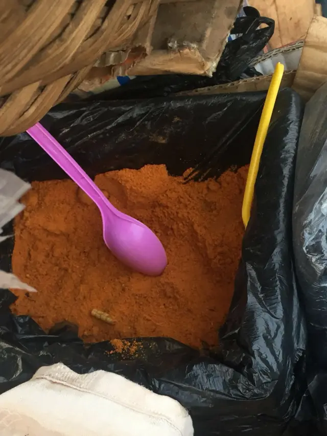 A grasshopper seller's bag of chilli powder in Masaka, Nigeria