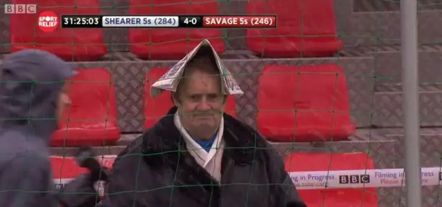 Man in hat in stands