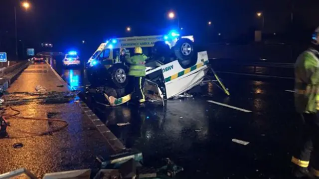 Two people were trapped inside the private ambulance on the M6 near Cannock