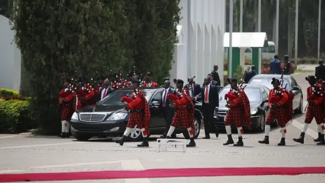 A convoy carrying Turkish President Tayyip Erdogan, escorted by presidential guards, arrives at the presidential palace in Abuja, Nigeria March 2, 2016