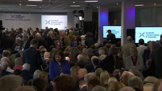 Members of the Scottish Conservatives await the prime minister's arrival to give a speech