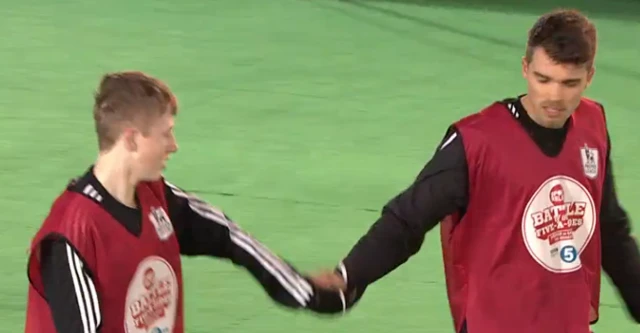 Josh Cuthbert shakes hands with a teammate
