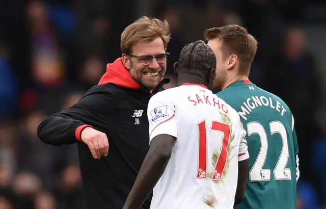 Jurgen Klopp celebrates with his Liverpool players