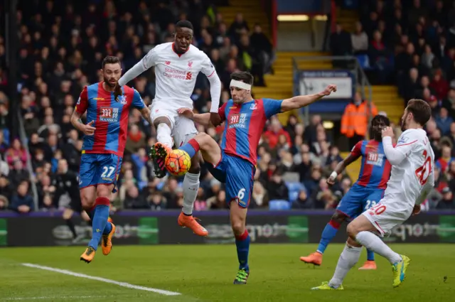 Divock Origi tries to capitalise on the Palace goalkeeper's error