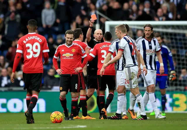 Mike Dean sends off Manchester United's Juan Mata