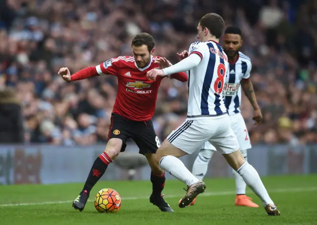 Juan Mata takes on West Brom's Craig Gardner