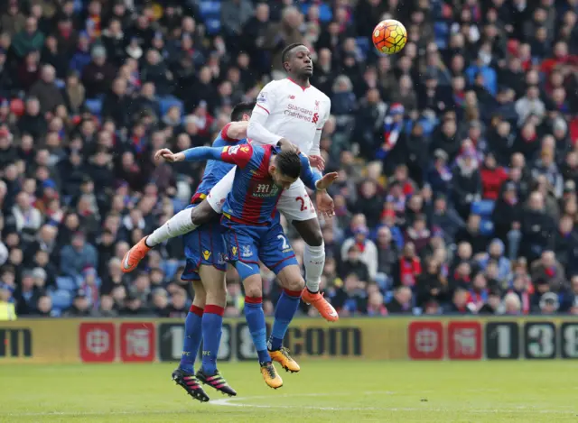 Divock Origi of Liverpool tussles with the Palace defenders