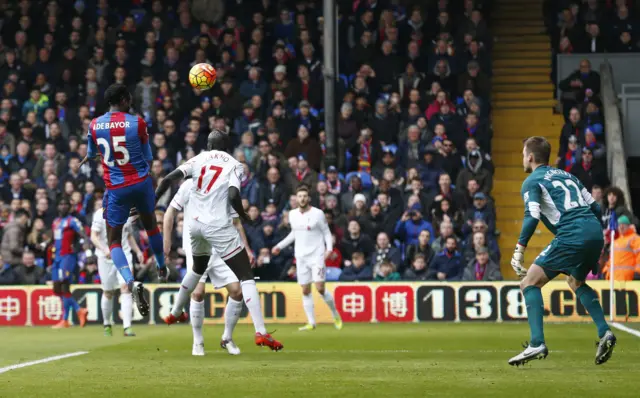 Emmanuel Adebayor heads against the crossbar