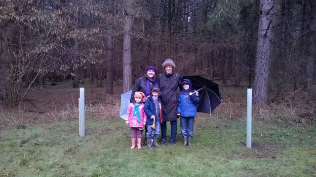 Ion Trewin's widow Sue, daughter and grandchildren