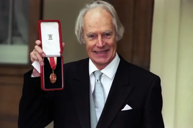 Sir George Martin with his knighthood at Buckingham Palace