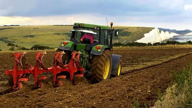 Tractor ploughing a field