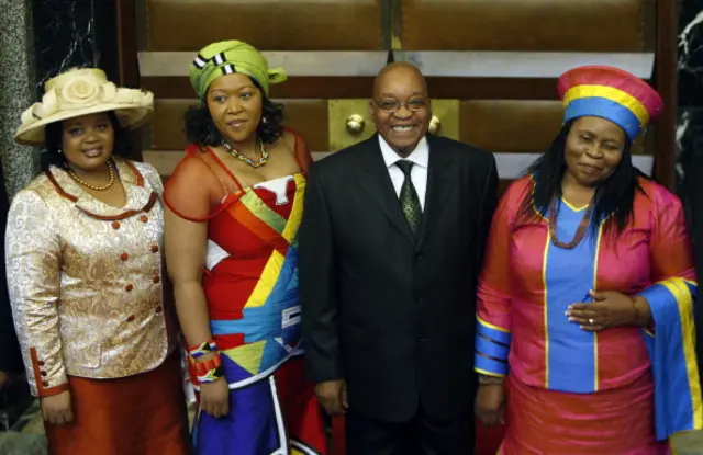 South African president Jacob Zuma (2ndR) poses for photographs with his three wives Sizakele Khumalo (R), Nompumelo Ntuli (L), and Thobeka Mabhija (2-L) after the State of The Nation address in Parliament, in Cape Town, on June 03, 2009