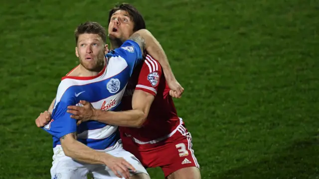 QPR's Jamie Mackie and Boro's George Friend jockey for the ball