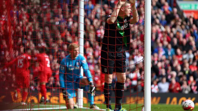 Goalkeeper Jakob Haugaard and Ryan Shawcross of Stoke City react as Liverpool score