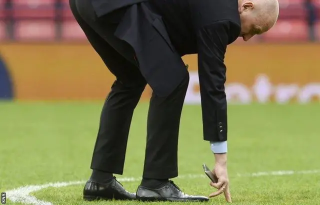 Mark Warburton checks the Hampden pitch on Sunday