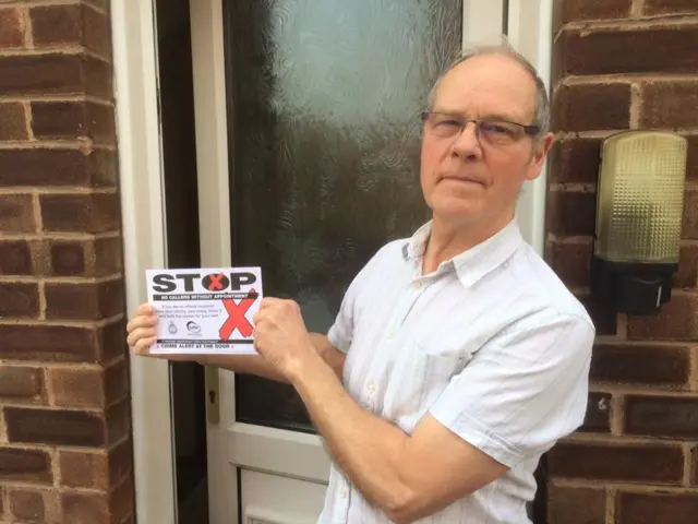 Man from Chesterfield holding note to stop charity door knockers