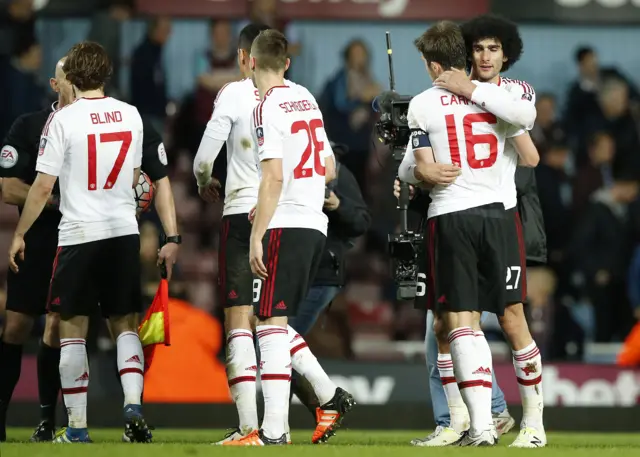 Manchester United's players celebrate at full-time