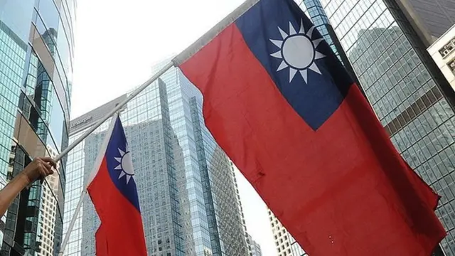 Protesters wave Taiwanese flags in Hong Kong on 17 September 2010.