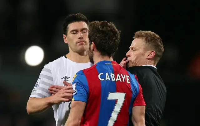 Gareth Barry and Yohan Cabaye are separated by the referee