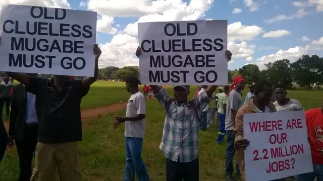 Signs being held up by MDC supporters in Harare, Zimbabwe