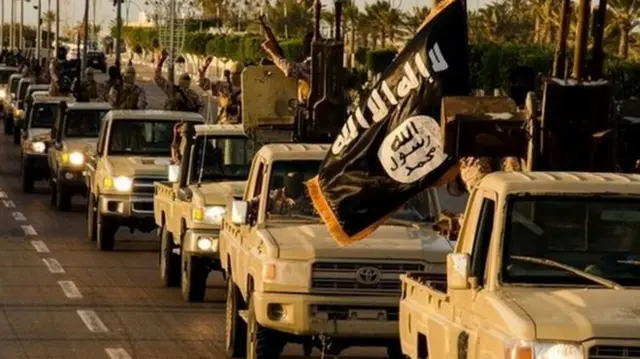 IS militants driving cars on road