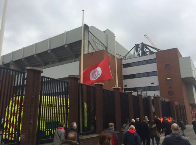 Flag at half mast outside Anfield stadium