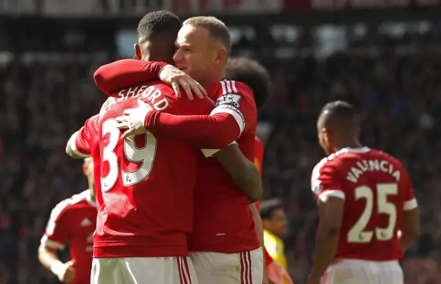 Marcus Rashford celebrates with Wayne Rooney