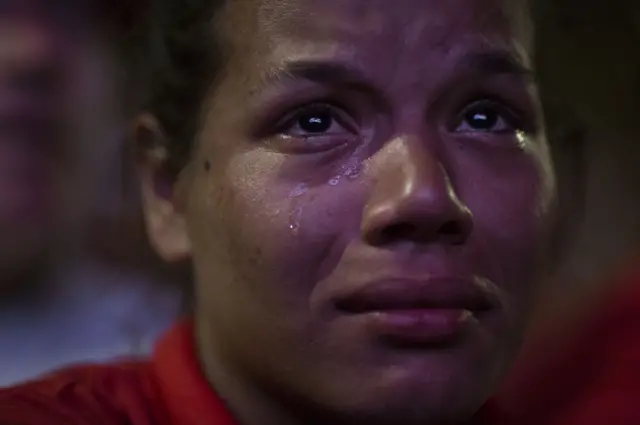 A pro-government demonstrator cries as she watches the vote count on a screen, as lawmakers vote on whether or not to impeach President Dilma Rousseff, in Brasilia.