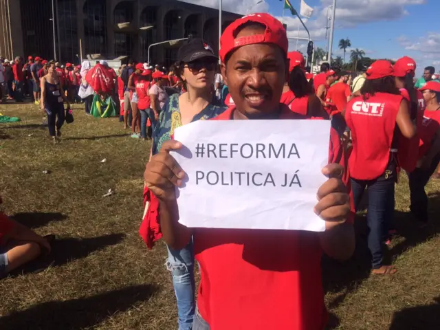 A man protests against the impeachment proceedings