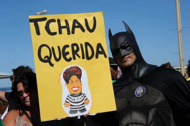 A man dressed as Batman campaigns against Brazilian President Dilma Rousseff