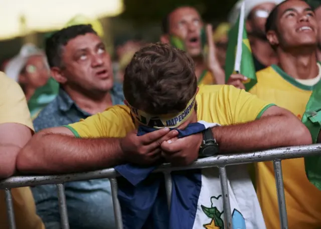 Brazilians in favor of the impeachment of President Dilma Rousseff react while watching the televised voting of the Lower House of Congress over her impeachment in Brasilia, Brazil April 17, 2016