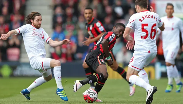 Liverpool"s Joe Allen and Connor Randall in action with Bournemouth"s Max Gradel