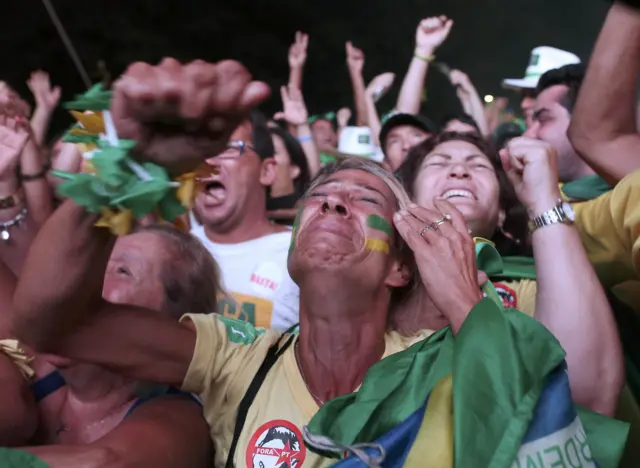 Opponents of President Dilma Rousseff celebrate after the lower house of congress votes to proceed with her impeachment in Brasilia on 17 April 2016.