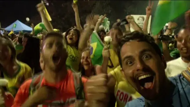 Brazilians cheer in the streets after lower house passes impeachment against President Rousseff