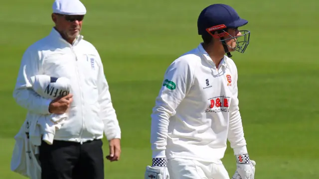 Alastair Cook leaves the field after being caught for one