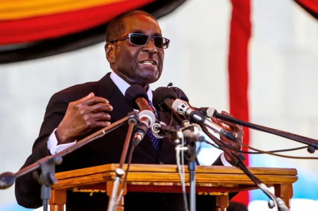 Zimbabwe President Robert Mugabe speaks during the burial of two national heroines, Victoria Chitepo and Vivian Mwashita, at the National Heroes Acre on April 13, 2016 in Harare