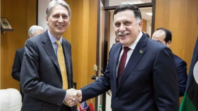 UK's Foreign Secretary Philip Hammond and Libya's PM-designate Fayez Sarraj